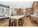 Spacious kitchen features wood cabinets, stainless appliances, and a large island with seating at 18514 Oriental Oak Ct, Noblesville, IN 46062