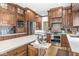 Gourmet kitchen boasts stainless appliances, wood cabinets, and a convenient mixer shelf at 18514 Oriental Oak Ct, Noblesville, IN 46062
