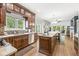 Kitchen with wood cabinets, stainless appliances, large island and view of breakfast nook at 18514 Oriental Oak Ct, Noblesville, IN 46062
