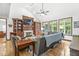 Cozy living room boasts a fireplace, built-in shelving, and view to backyard at 18514 Oriental Oak Ct, Noblesville, IN 46062