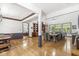 Spacious living room featuring hardwood floors, large windows, and built-in bookshelves at 18514 Oriental Oak Ct, Noblesville, IN 46062