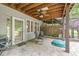 Covered patio with cozy seating and easy access to the backyard at 18514 Oriental Oak Ct, Noblesville, IN 46062