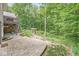 Relaxing backyard patio, complete with stone pavers, access to the deck and plenty of lush foliage at 18514 Oriental Oak Ct, Noblesville, IN 46062