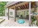 Covered patio with cozy seating and easy access to the backyard, and a ceiling fan overhead at 18514 Oriental Oak Ct, Noblesville, IN 46062