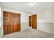 Serene bedroom featuring carpeting, closet with wooden doors, and neutral decor at 1868 N Hawthorne Ln, Indianapolis, IN 46218