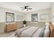 Relaxing bedroom with neutral tones, ample natural light, and stylish furnishings at 1868 N Hawthorne Ln, Indianapolis, IN 46218