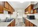 Galley kitchen featuring matching cabinetry and appliances at 1868 N Hawthorne Ln, Indianapolis, IN 46218