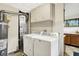 Bright laundry area with white washer and dryer plus cabinets for optimal storage solutions at 1868 N Hawthorne Ln, Indianapolis, IN 46218
