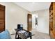 Functional home office space with a desk and view of the bathroom at 1868 N Hawthorne Ln, Indianapolis, IN 46218