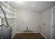 Unfinished basement, providing ample space for storage or customization, with updated flooring at 1902 N Colorado Ave, Indianapolis, IN 46218