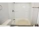 Clean and functional bathroom featuring a shower-tub combo, toilet and towel rack at 1902 N Colorado Ave, Indianapolis, IN 46218