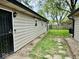 Cozy backyard features a well maintained lawn, stone walkway, and privacy fence, creating an inviting outdoor space at 1917 W Norwood Dr, Muncie, IN 47304