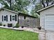A backyard with a wooden privacy fence and detached garage, offering a secluded space at 1917 W Norwood Dr, Muncie, IN 47304