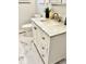 Bathroom with marble countertop on vanity and marble floors next to toilet at 1917 W Norwood Dr, Muncie, IN 47304