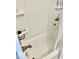 Bathtub shower with soap holder, bronze faucet, and white shower panels at 1917 W Norwood Dr, Muncie, IN 47304