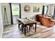 Inviting dining area featuring a glass-top table and views of the living room at 1917 W Norwood Dr, Muncie, IN 47304