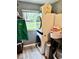 Laundry room featuring a stacked washer and dryer, a window, and a laundry basket at 1917 W Norwood Dr, Muncie, IN 47304