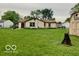 Wide backyard featuring a home and shed, perfect for gardening or recreation at 1998 Crescent St, Franklin, IN 46131