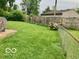 A lush backyard featuring green grass and a fence, perfect for outdoor activities at 1998 Crescent St, Franklin, IN 46131