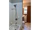 Bathroom featuring a tiled tub and shower, toilet, and window at 1998 Crescent St, Franklin, IN 46131
