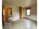 Spacious bedroom featuring neutral walls, closet space, and a window offering natural light at 1998 Crescent St, Franklin, IN 46131