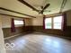 Spacious bedroom with beamed ceiling, paneled walls, and vinyl flooring at 1998 Crescent St, Franklin, IN 46131