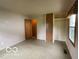 Spacious bedroom featuring neutral walls, closet space, and a window offering natural light at 1998 Crescent St, Franklin, IN 46131