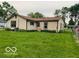 Classic home featuring lush green lawn and simple, neutral siding at 1998 Crescent St, Franklin, IN 46131