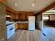 Cozy kitchen featuring wood cabinets, gas range, and modern flooring at 1998 Crescent St, Franklin, IN 46131