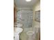Bathroom featuring dual sinks, tub and shower combo, and tile flooring at 202 S Church St, Brooklyn, IN 46111