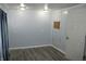 Simple bedroom with new floors, fresh paint, and neutral lighting at 202 S Church St, Brooklyn, IN 46111