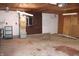 Interior of garage with utilities including water heater and furnace at 202 S Church St, Brooklyn, IN 46111