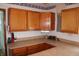 Kitchen with dated oak cabinets, laminate countertops, and dated appliances at 202 S Church St, Brooklyn, IN 46111