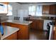 Bright kitchen with wood cabinets, laminate countertops, and appliances at 202 S Church St, Brooklyn, IN 46111