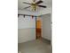View of the living room with a ceiling fan and doorway at 202 S Church St, Brooklyn, IN 46111