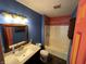Bathroom with vanity, toilet, tub/shower and bright colored doors at 2133 10Th St, Columbus, IN 47201