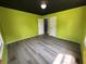 Bedroom with laminate flooring and two windows at 2133 10Th St, Columbus, IN 47201
