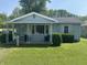 Charming single-story home with a covered front porch and well-maintained lawn at 2133 10Th St, Columbus, IN 47201