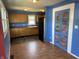 Charming kitchen with oak cabinets and black appliances, accessible from the main living area at 2133 10Th St, Columbus, IN 47201