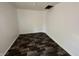 An empty bedroom featuring updated floors at 2310 E Raymond St, Indianapolis, IN 46203