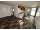 Kitchen with wood cabinets, white appliances, and faux wood floors in an open layout at 2310 E Raymond St, Indianapolis, IN 46203