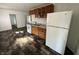Open kitchen featuring a white refrigerator and faux wood flooring at 2310 E Raymond St, Indianapolis, IN 46203