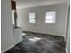 Spacious eat-in kitchen area featuring resilient flooring, great natural light, and a washer/dryer hook up at 2310 E Raymond St, Indianapolis, IN 46203