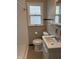 Classic bathroom with tiled walls, updated vanity, and shower at , Beech Grove, IN 46107