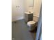 Compact bathroom featuring a toilet, sink vanity, and mirrored medicine cabinet at , Beech Grove, IN 46107