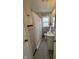 Bathroom featuring a shower, toilet and sink with white and red tiling at , Beech Grove, IN 46107