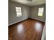 Light-filled bedroom showcases hardwood floors and neutral paint at , Beech Grove, IN 46107