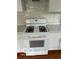 Modern kitchen with white appliances, countertops, and white cabinets at , Beech Grove, IN 46107
