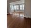 Well-lit living room showcases multiple windows and hardwood floors at , Beech Grove, IN 46107