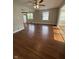 Open living room boasts hardwood floors, natural light, and a ceiling fan at , Beech Grove, IN 46107